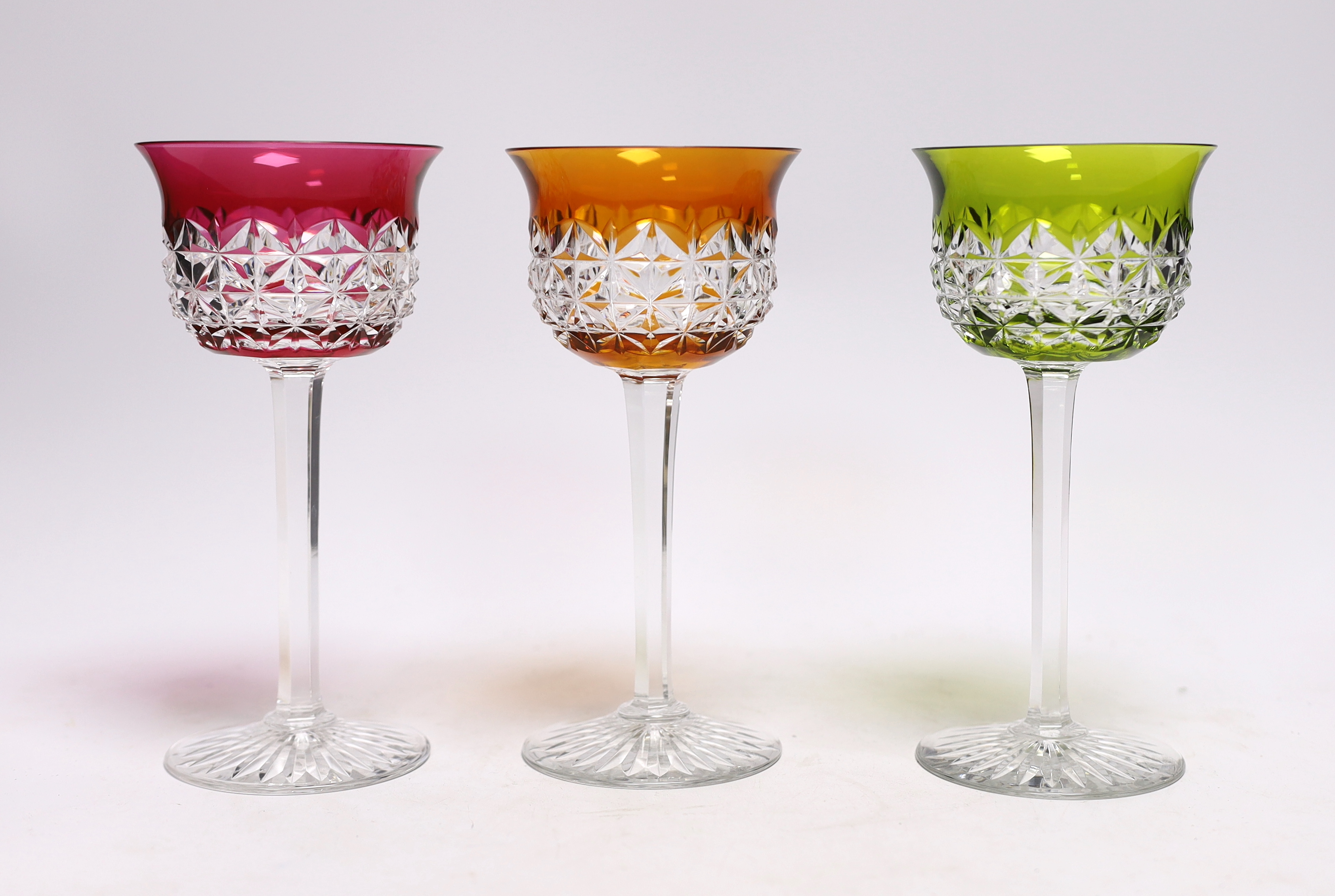 Six Baccarat coloured cut wine glasses, 18cm high